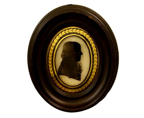 English School - good reverse glass silhouette bust portrait of a gentleman with a ruffled collar wearing a court wig inscrib