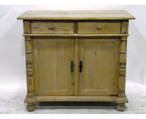 Pine side cupboard, the moulded edge top above two short drawers, with a pair of panel doors below enclosing shelf, flanked b