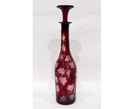 A ruby etched flash glass decanter, vine decorated, 36cm high 