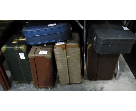 A canvas and wood bound trunk, a picnic set and four other vintage suitcases
