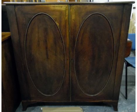 Georgian mahogany bookcase, the pair of oval panelled doors enclosing adjustable shelves, raised on splayed bracket feet, wid