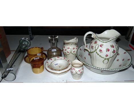 Toilet set including ewer and basin, soap dish, small water jug by Mintons, cream with rose and green foliage design, a caraf