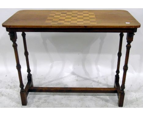 Victorian walnut games table, the rectangular top with chequerboard inlay, on elegant ring turned supports united by stretche