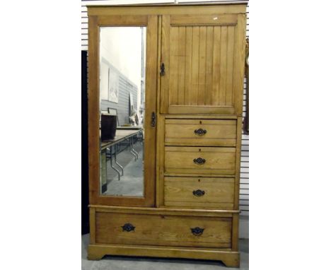 Late Victorian pale oak compactum, the mirror plate panel door enclosing hanging space, beside a panel cupboard enclosing she