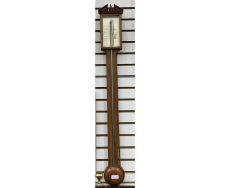 19th century mahogany stick barometer, the case with broken arch pediment, the steel dial inscribed 'Signor Manansegna' and i