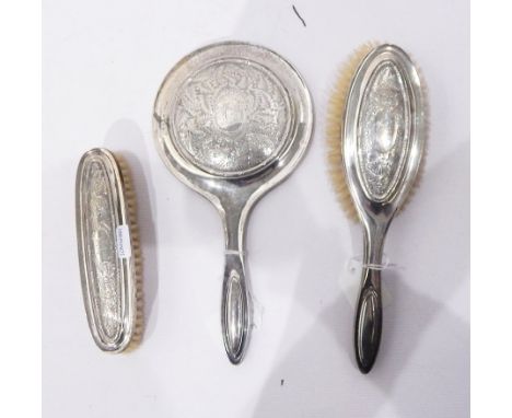 Early 20th century silver-backed dressing set comprising mirror and two brushes, leaf engraved decoration with initial 'G', B