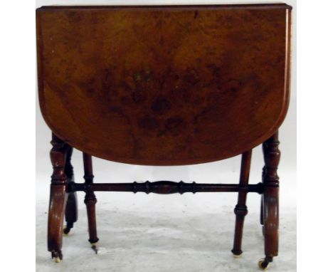 Late Victorian walnut veneered sutherland table, the top with moulded rounded borders, on turned supports and central stretch