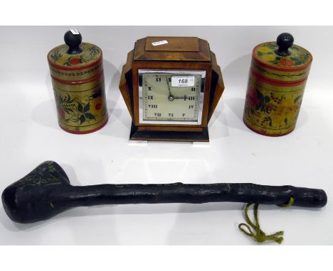 An Art Deco walnut and ebonised mantel clock by Elkington within a chrome frame and on chrome feet, a painted club and two pa