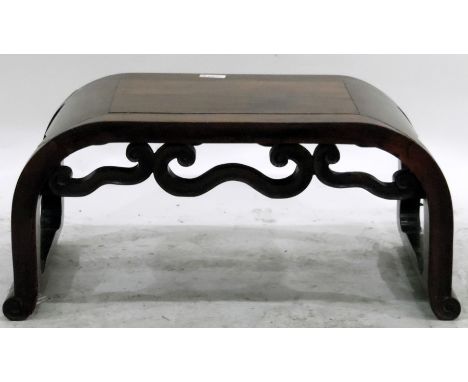 Chinese hardwood stool of curved form, with scroll brackets and feet, 55cm wide 