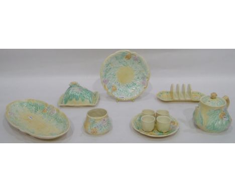 Avonware breakfast set, cream ground with moulded green, mauve and blue floral design, comprising teapot (damaged), oval dish