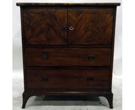 Georgian mahogany converted commode, the pair of panelled doors with circular flame mahogany inlays, two drawers below, on sp