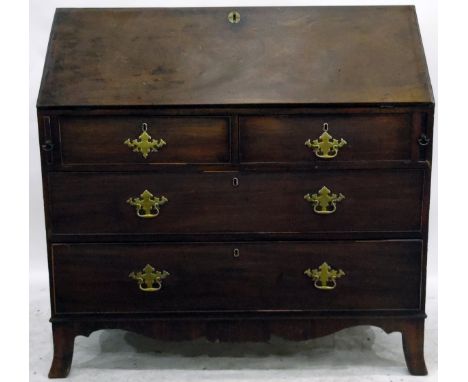 Georgian mahogany bureau, the fall front enclosing central cupboard, pigeonholes and small drawers, with two short and two lo
