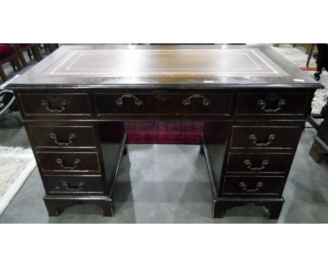 20th century mahogany pedestal desk with leather inset writing top, an arrangement of nine drawers, on bracket feet, 122cm wi