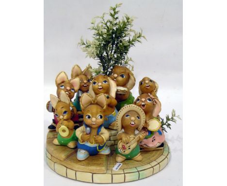 Collection of Pendelphin rabbits playing instruments, on band stand 