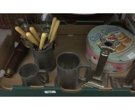 Assorted metalware to include pewter tankards, silver-coloured metal candlesticks, fire tools, cake tins, antique copper helm