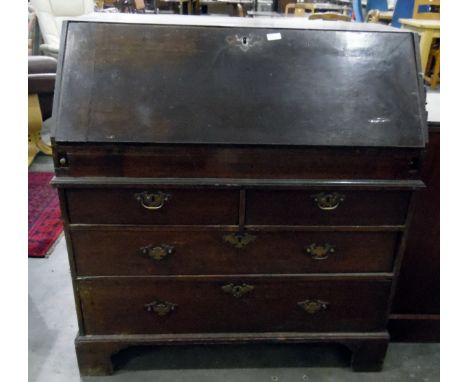19th century oak bureau with fall-front enclosing drawers and pigeonholes, above two short and two long drawers, on bracket f