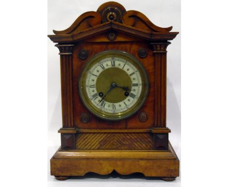 Edwardian walnut mantel clock with eight-day gong striking movement, the case with carved scroll pediment, pilasters to shape