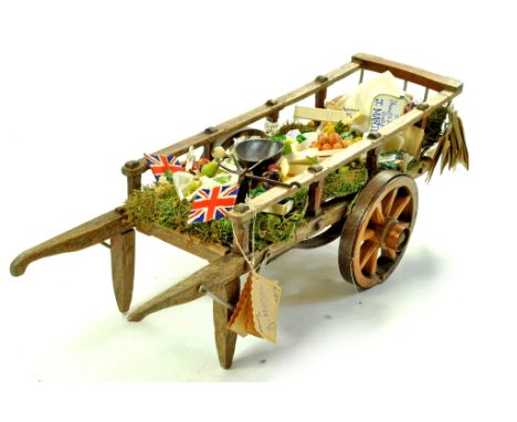 Dolls House Furniture. A large and impressive vintage wooden cart, of age which has been modelled (displayed) as a Vegetable 