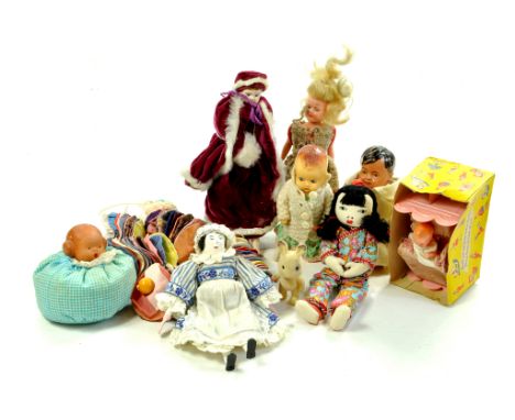 An interesting lot of vintage dolls, various makers, types and materials.  Enhanced Condition Reports: We are more than happy