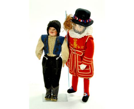 Vintage 11" cloth and felt yeoman of the guard. Cloth and felt, wool beard doll, top of lance missing, otherwise good. Plus s