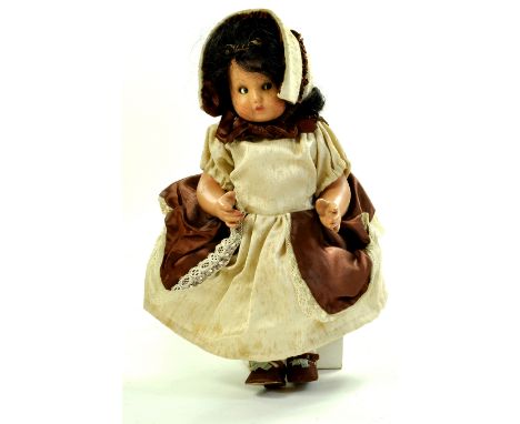 Unusual 13” Vintage doll. Unidentified, no markings. Hard rubber?, painted face, glass side glancing/googly eyes, painted lar