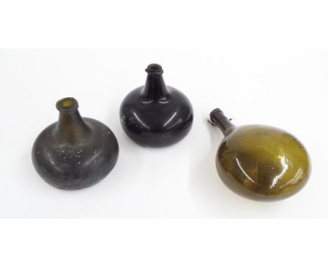 Two similar globe and shaft antique wine bottles, both 6" high; also another antique green glass flask, 11" long (3)