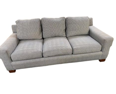 A large three seater sofa, retailed by Ralph Lauren. Upholstered in a black and white Prince of Wales check. In generally goo