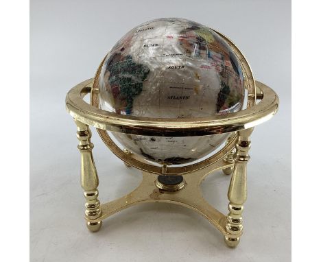 A table top gem set globe in gilt metal mount with compass to base, 27cmH 