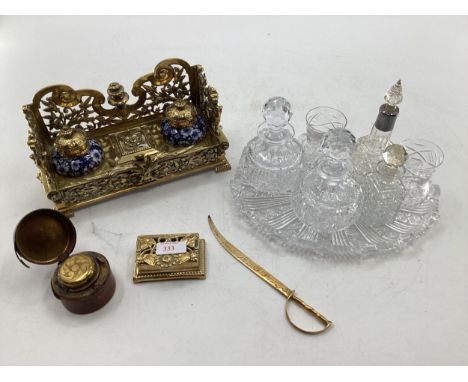 Brass desk tidy/inkwell with two ceramic inkwells and lidded recess for stamps, together with brass stamp box, crystal glass 