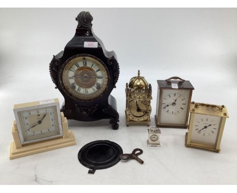 French cast metal mantle clock with white enamel chapter ring in the Rococo style by Ansonia Clock Company New York together 