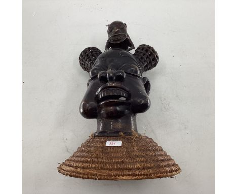 Mid to late C20th West African cast metal item depicting tribal chief topped with mythical creature 47cm H 