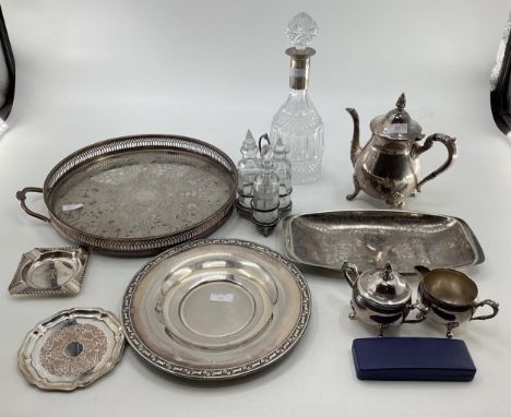 A collection of silver plated wares to include a white metal collared decanter, tray and other items 