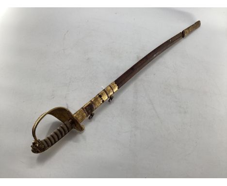 A C19th naval officers dress sword, shagreen wired grip, lion head pommel, and gilt metal basket, original gilt and leather s