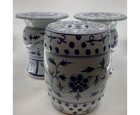 A pair of Oriental style ceramic blue and white garden or conservatory seats with Dragon decoration to top , and a drum shape