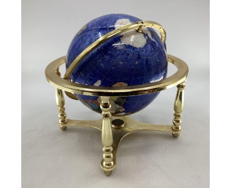 A Lapis style globe mounted with minerals and semi precious stones in gilt wire settings, with compass to base on gilt metal 