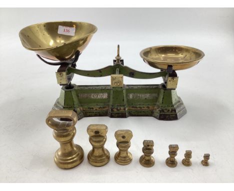 A set of metal scales, brass pans and weights, 30cm W  not tested 