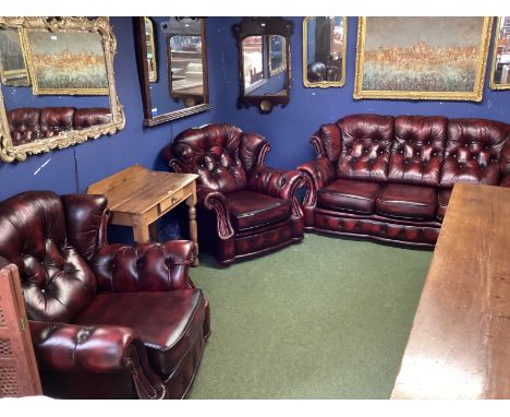 A WINCHESTER FURNITURE, red leather button backed suite of a two seater sofa and 2 large armchairs