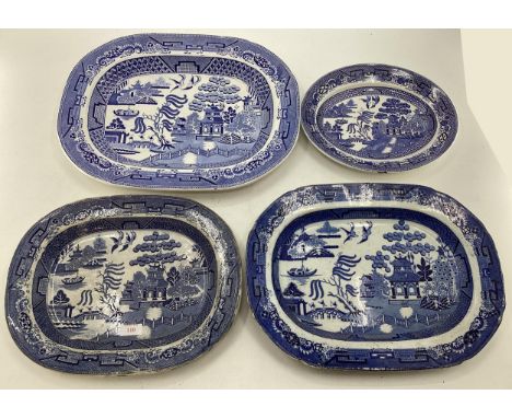 Four ceramic Willow Pattern serving dishes, largest 43cm x 35cm 