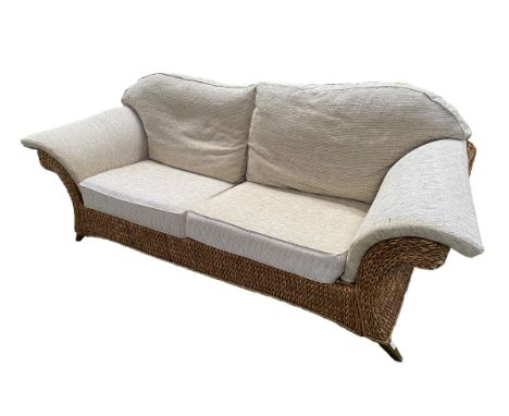 A good  large rattan conservatory sofa with fitted upholstered cream cushions, 215 x 98 x 92cm, some wear 