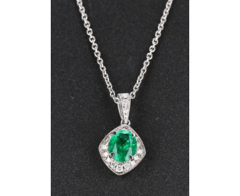 Attractive 18ct emerald and diamond pendant on a fine chain, the emerald 0.50ct approx, 2.5gm, the pendant 16mm 