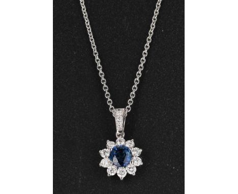 18ct white gold sapphire and diamond cluster pendant an a fine chain, the sapphire 0.33ct approx, 3.4gm, the pendant 15mm, th