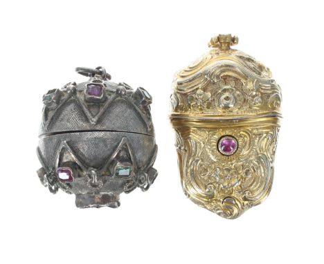 Ornate silver gilded floral embossed pendant pill box, with foliate designs and set with a pink cabouchon stone, 17.3gm, 40mm