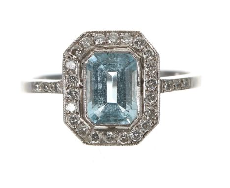 18ct white gold aquamarine and diamond cluster ring, emerald-cut aquamarine 0.90ct approx, in a border of round brilliant-cut