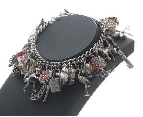 Silver charm bracelet with forty various silver and white metal charms,&nbsp;99.6gm 