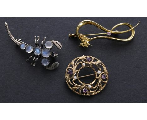 9ct amethyst and pearl set openwork circular brooch, 7.2gm, 34mm; yellow metal gem set brooch, 6.8gm; also a silver moonstone