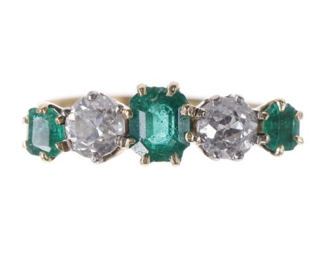 Attractive emerald and diamond five stone ring, the three emeralds 0.68ct approx, with two old-cut diamonds, estimated .46ct 