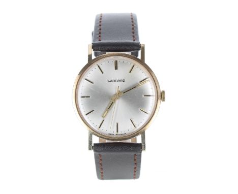 Garrard 9ct gentleman's wristwatch, circular silvered dial, inscribed case, modern brown leather strap, 33mm-** Garrard case-