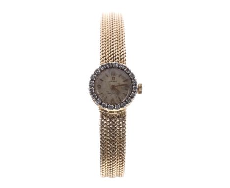Omega Ladymatic 18k diamond set wristwatch, reference no. SC7067, serial no. 16014xxx, circa 1958/59, silvered dial, the beze