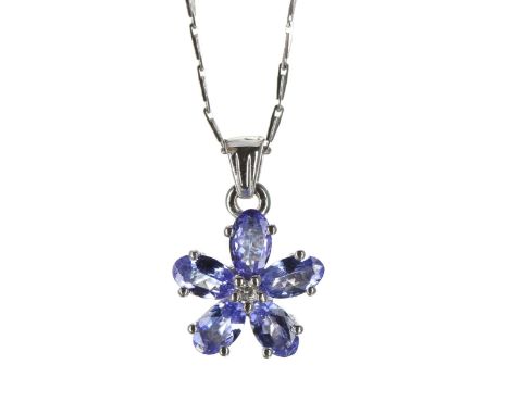 Tanzanite and diamond 9ct white gold flower pendant on a slender neck chain, the pendant 17mm x 11mm, the neck chain 15" long