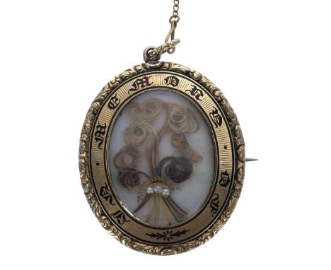 19th century oval yellow metal and enamel mourning brooch with a pendant attachment, inscribed 'In Memory of'&nbsp;and inset 